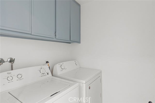 Laundry room with machines included