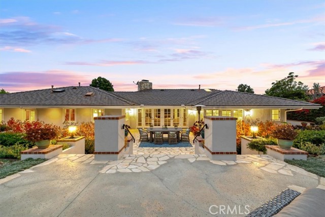 Stone paved patio off of Family Room and Main Bedroom, leading to pool level.