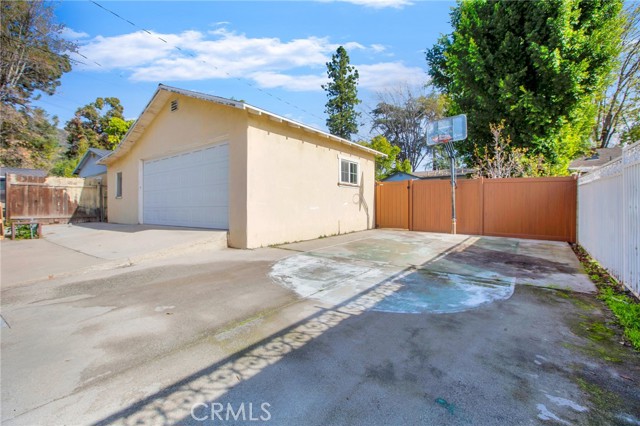 concrete pad adjacent to garage