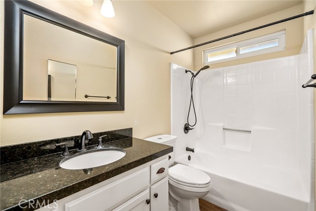 The main bathroom has been updated with granite countertops and newer fixtures.