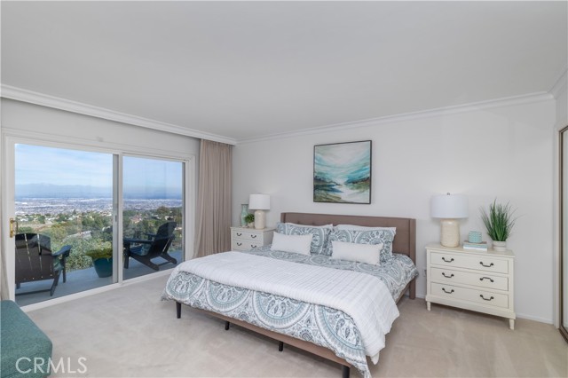 Primary bedroom with balcony