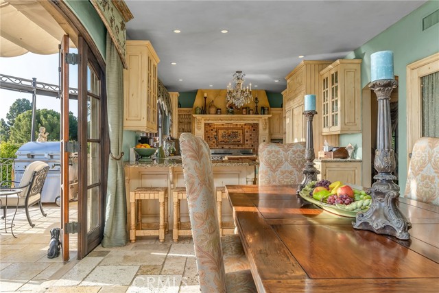 Informal dining area leads out to large patio.