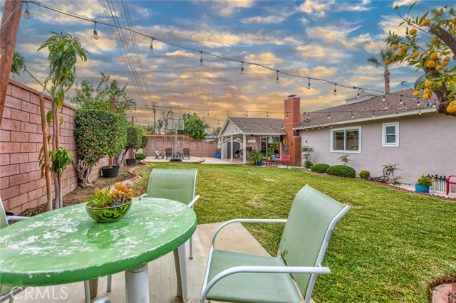 Backyard has two concrete slabs for furniture