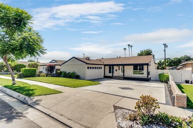 Wonderfully Remodeled Home in La Mirada! This home features a nice and open floor plan! As you walk in, you'll be amazed by the sheer size and openness of it. The Kitchen is an entertainers delight which includes Frigidaire stainless steel appliances, even included is a Refrigerator! The whole house has New laminate flooring throughout, New fixtures, New interior doors, New Dual Pane windows, New recessed lighting. Home has Central Air and Heat and has laundry hookups in the hallway. Two beautifully remodeled bathrooms with floating vanities and water saving toilets and shower heads. Main bedroom is a suite with it's own bathroom, walk-in closet with barn doors and has a sliding glass door with a New deck! Last but not least is the size of the family room, it can surely make for a wonderful gathering of movie watching or playing board games with family and or guests, the possibilities are endless with this space! You'll love this home and the location, it's most definitely an A+!