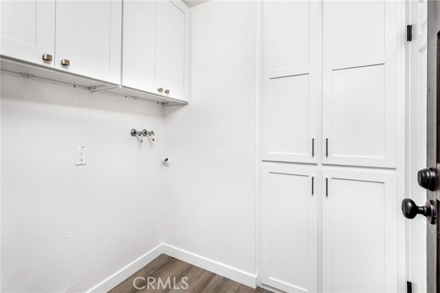 Laundry room with tons of storage.