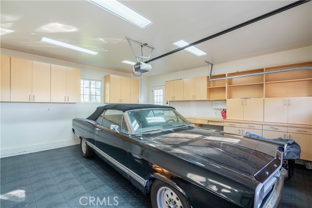 Garage with storage.
(Car not included in sale)
