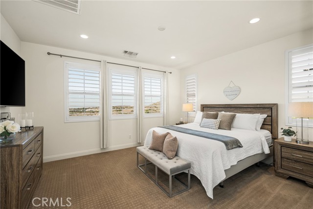 Serene Primary Suite with Expansive Hill Views