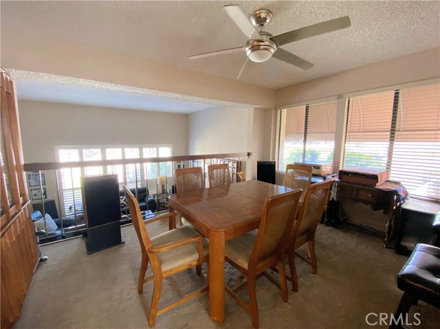 The bright dining room opens up to the living room