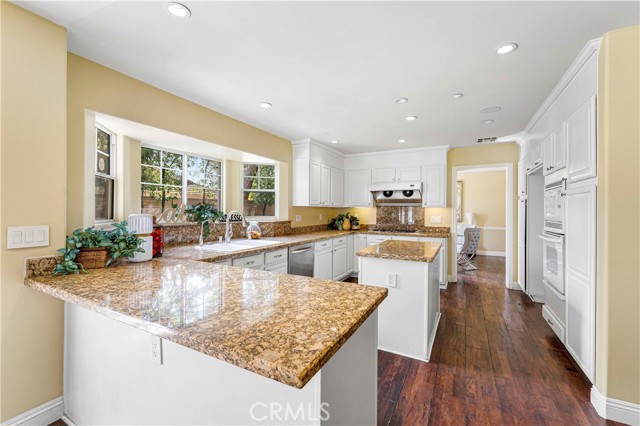 Open kitchen with big windows to see the back yard view