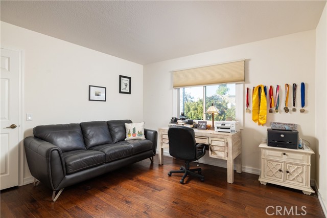 Upstairs bedroom, or optional office, share neighboring full bath.