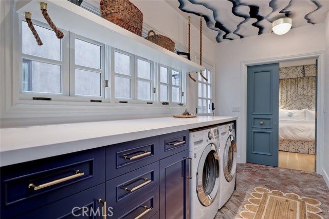 Sleek, New Laundry Room peaking into Primary suite