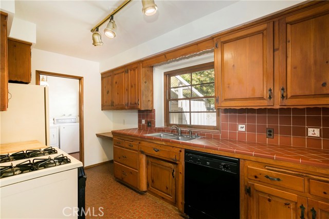 Kitchen and Laundry room, plus half bath, are conveniently located