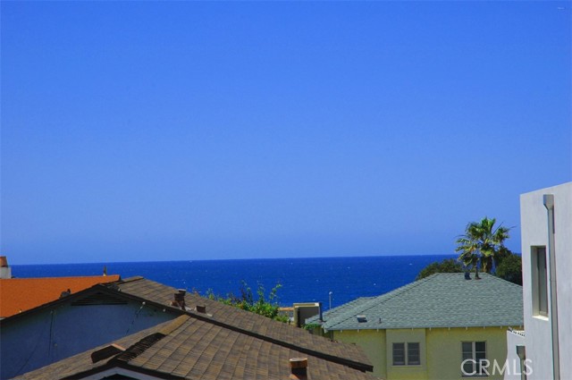 Your view from  the living room of the 1 bedroom unit facing Ozone Court. Keep your windows open so you can hear the waves, smell the salt air, feel the ocean breeze and see the pelicans fly by in formation!