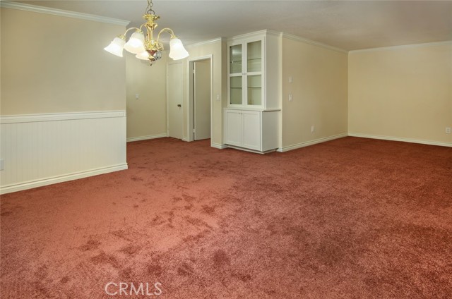 Entry closet and charming built-in cabinet.