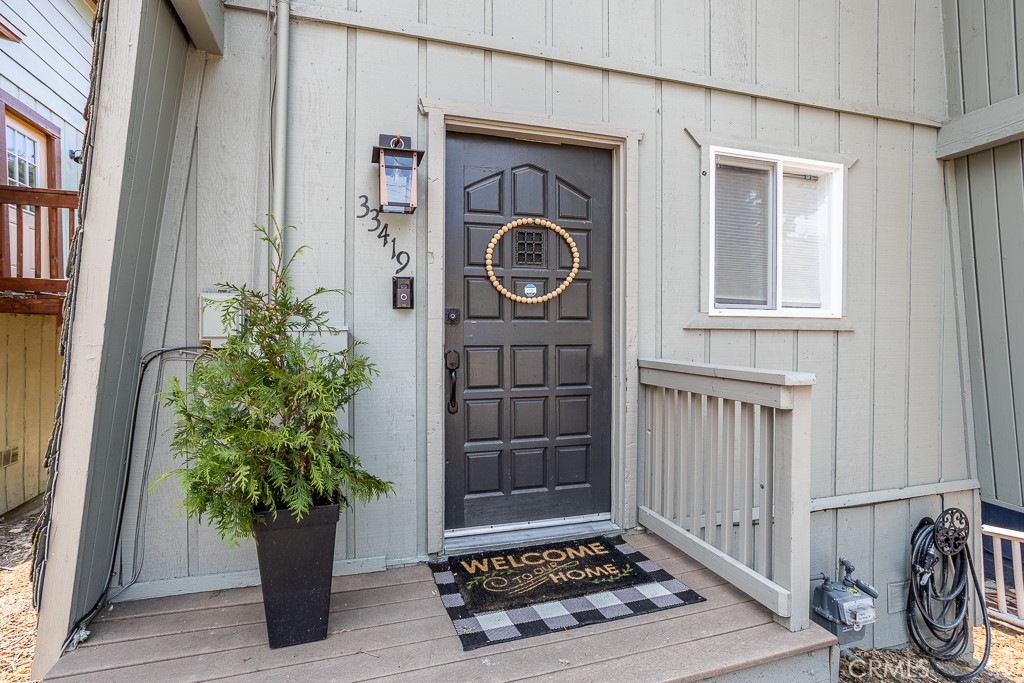 33419 Cedar Drive Running Springs, California Fantastic turnkey Airbnb ready to go, offering great views and quiet days on the mountain. This home comes fully furnished! Move right in and not have to worry about a thing. Enter into the open floor-plan of the kitchen and living room featuring granite countertops and a cozy wood-burning fireplace. There is a large sliding glass door providing plenty of natural light and giving you access to the spacious patio great for entertaining and relaxing. Heading upstairs you will find the two spacious bedrooms one featuring a balcony giving you views of the wooded hillside. This cabin is currently a successful vacation rental but would be great for full or part time living. Minutes from Downtown Running Springs, Snow Valley Ski Resort and Tubing Park, Santas Village, Green Valley Lake, lots of shops and restaurants, 15 Minutes to Lake Arrowhead and about 30 minutes to Big Bear.