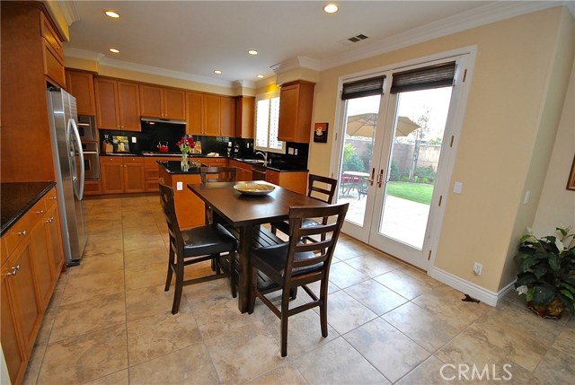 Lovely French Doors lead to Backyard