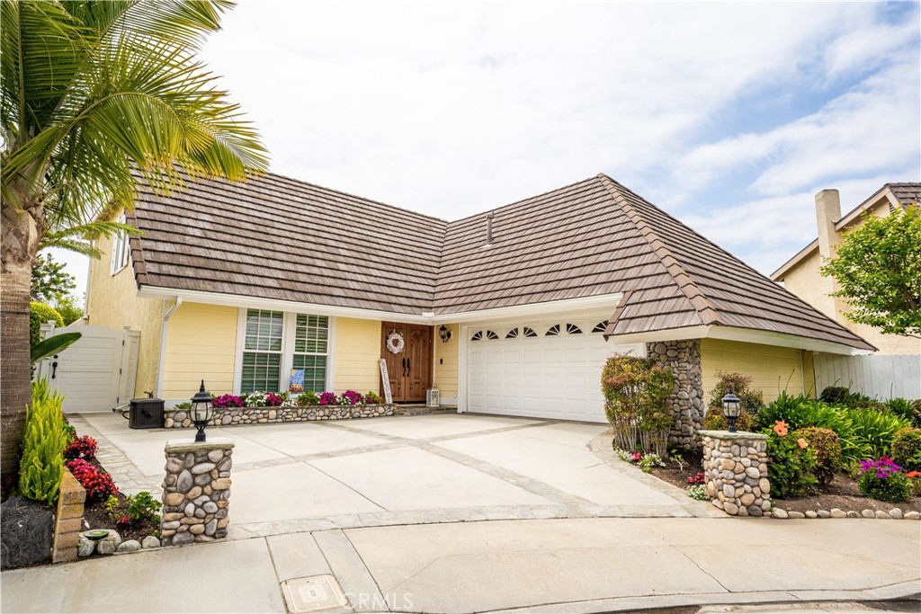 16681 Parlay Circle Huntington Beach, California Don’t miss your opportunity to own this meticulously maintained two- story home on a quiet cul-de-sac in Huntington Beach. Just a short stroll from the beach, Huntington Harbor and hiking trails at Bolsa Chica Wetlands this home is ideally located for you to enjoy the many recreational opportunities nearby. Upon entering this beautiful home you are greeted by the bright, open living room with recessed lighting and formal dining area. French doors lead to the entertainers rear yard and cool ocean breezes. From the dining area you enter a gorgeous remodeled kitchen with a five- burner gas range, elegant granite counters and recessed lighting that opens to a delightful family room that includes a cozy fireplace with a beautiful mantle as well as a ceiling fan. Downstairs you will find a large bedroom with a walk-in closet, ceiling fan and attached full bath with custom cabinets, luxury marble countertops and high -end fixtures. Moving upstairs you will be led to the sizable master bedroom with more than ample closet space as well as a ceiling fan. The attached master bathroom again exhibits the owner’s generous appointments of custom oak cabinetry, marble countertops and high- end fixtures. Additionally, the upstairs boasts two very spacious bedrooms. One featuring recessed lighting and the other a ceiling fan. Both have large closets. The third full custom bathroom is also upstairs with custom cabinetry, high- end fixtures and granite counter tops. The house has newer central air and heating, all controlled by “Nest”. The backyard is truly an entertainer’s paradise. It consists of a rear and side yard surrounded by block wall fencing. The side yard has a lawn area with a fenced portion that is ideal for a dog run. The main backyard is very large and recently covered by pavers and contains a built in gas Bar-B-Que and sink. The entire backyard is hinged by a continuous River- Rock planter containing a variety of lush green plants and trees. Both back yards have covered patios that were recently redone and upgraded. The yards are beautiful as is, but provide ample space to add a pool if so desired. There is an attached two car garage that provides direct access to the house and backyards. The home has dual pane windows and crown molding throughout as well as plantation shutters on the windows. The front portion of the roof is tile and the rear roof was redone completely last year. DON’T LET THIS GEM PASS YOU BY!!