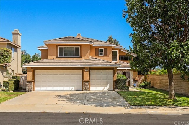 14045 Country Walk Lane Chino Hills, California 4 bedroom 3 bath radiant upgraded home in spectacular condition! Two story open floor plan with plenty of natural light. Spacious family room with access to the backyard. Upgraded kitchen with modern quartz counter tops and stainless steel appliances. Upgraded master bathroom with double sinks, independent bathtub and separate shower. Other features include wood floors throughout first floor, carpet in upstairs, tiles in kitchen and bathrooms. Individual laundry room on the first floor. Private backyard with built-in BBQ island for entertaining. 3 car garage. Beautiful landscape. Breathtaking valley and rolling hills views! Excellent location! Close to schools, shopping centers and parks.