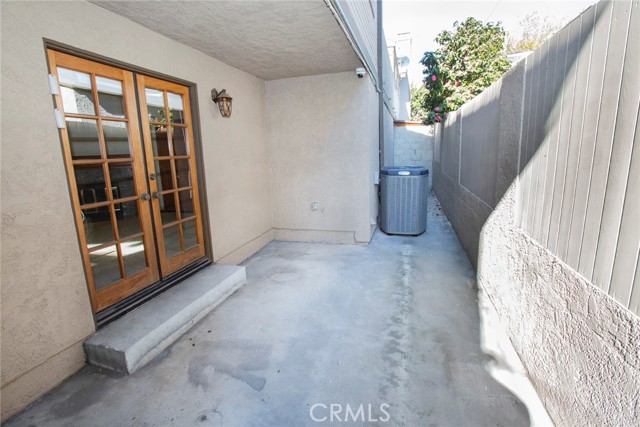 French Doors from Family Room to side enclosed patio.