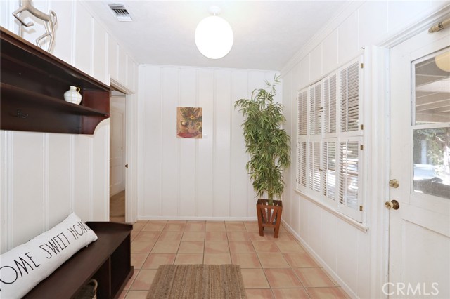 Mudroom - access to two front bedrooms and bathroom, door to patio, access to family room and kitchen