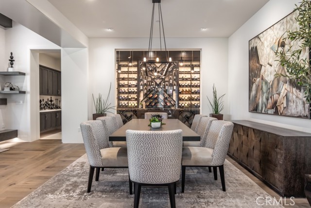 C1 floorplan of dining room plus glass wine storage room. Please note that this photo shows a completed, private residence, not the home under construction.