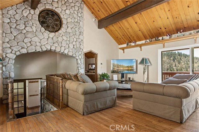 Living room with stone wall and stain glass.