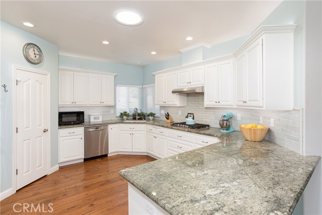 Granite kitchen counters and a walk in pantry are included.