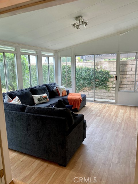 Bonus room with walls of glass for allowing the outside in! Great space for family, exercise or game room!