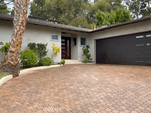 223 Giardino Way Pacific Palisades, California Just 5 Blocks from the Beach! Serene and Tranquil setting on a quiet and private Cul-de-Sac off Tramonto. Light and bright Three Bedroom and Four Baths + Den/Office or Guest Room. Granite Kitchen counters with high quality appliances and breakfast area. Beautiful wood, stone and tile, high beamed ceilings, skylights and more. Romantic yard with large deck backed by a grove of large pine trees that are a butterfly breeding ground - plus spa and Ocean View! This Dramatic, bright and open home feels like an inspired resort, exquisitely combing sophistication and priceless tranquility.