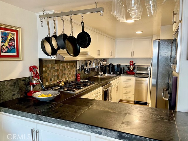 Kitchen opens to living room.