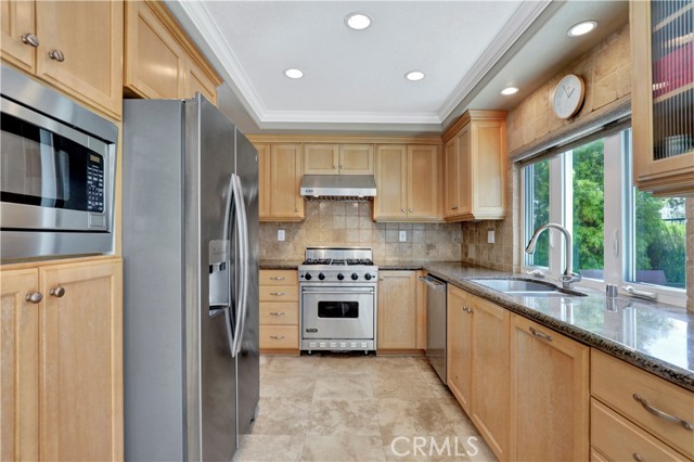 Kitchen w/ view to pool & patio