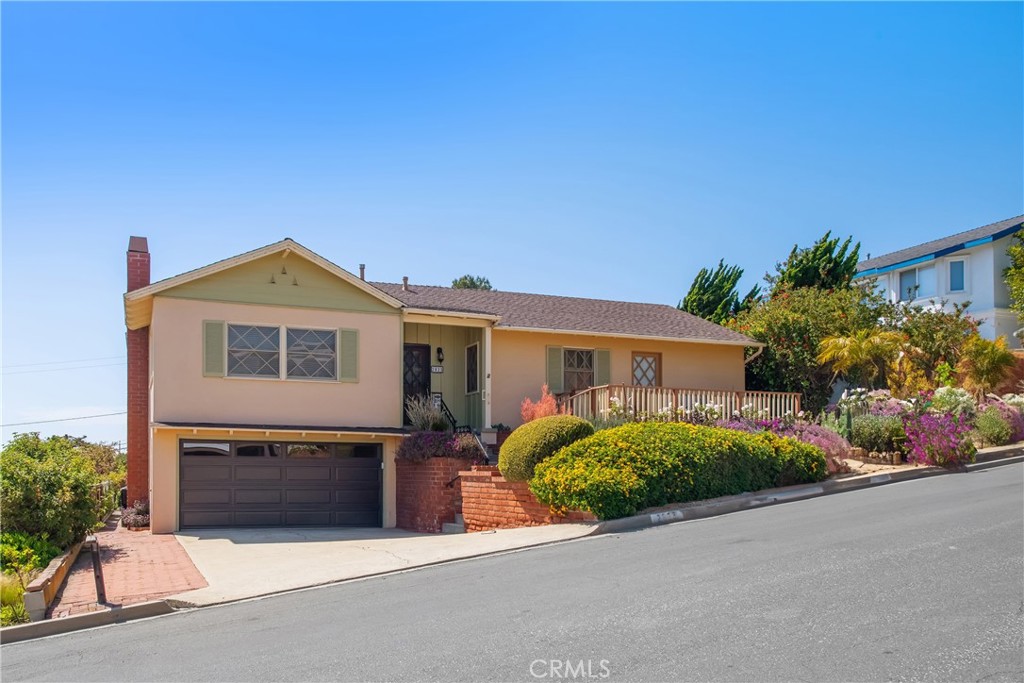 Perched atop of one of the most desirable cul-de-sac streets in the Hill Section of Hermosa Beach, sits an opportunity to build or remodel your dream home in a location that does not become available often. This rare property features an expansive lot size of over 8,100 square feet on a quiet and private street with only a small batch of similar properties. The current residence is a classic traditional Hermosa Beach home that sits at the top of the lot allowing for exceptional ocean views extending from Catalina to Manhattan Beach from the back of the home and a massive backyard that can only be found in a few pockets of the South Bay. When you decide to build or remodel here, you won't have to sacrifice space, location, views or yard. The location is unmatched, blocks away from some of the best beaches in Southern California, quaint grocery stores that make you immediately feel like a local, award winning schools, tree lined walking paths and well-maintained parks. Have it all and more with this extremely rare and incredible opportunity on El Oeste.