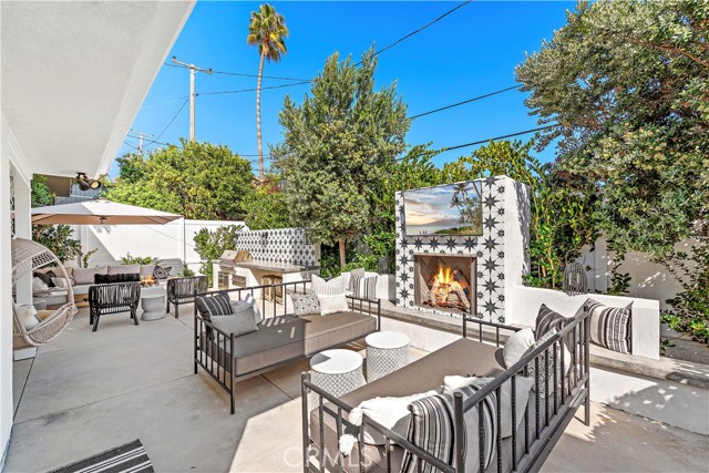 Two daybeds, fireplace and TV make for the perfect afternoon lounging.
