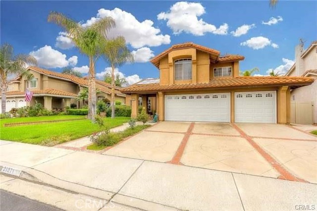 21071 Ashley Lane Lake Forest, California The highly sought after Normandale Heights home Located on a quiet cul-de-sac street close to Blue ribbon School, Skate park, Shopping, and more. This stunning executive home is beautifully updated and maintained. Enter the foyer through double doors, Cathedral vaulted ceiling, open Formal living room, formal dining, Main floor bedroom with an en-suite bathroom, Upgraded Travertine, and wood flooring throughout the whole house, Spacious gourmet kitchen(New stainless steel appliances)with breakfast bar and kitchen nook that opens to the large family room, Large Master bedroom with walk-in closet, dual sink vanities, Upgraded Glass shower and Soaking tub. Additional 3 Bedrooms upstairs. Inside laundry room with a utility sink is located off the 3 car garage. Brand new 3 car garage doors with a new epoxy floor. Newer Vinyl fencing in a well-kept neighborhood. The large backyard is perfect for entertain. Low HOA, No Mello Roos, Low Tax Base.