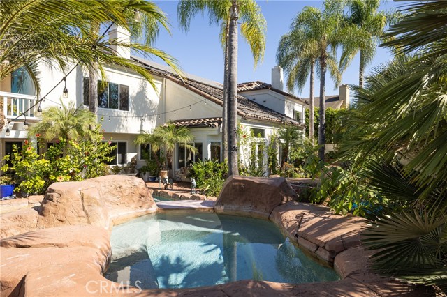 Private jacuzzi surrounded by lush landscaping creates the feel of a tropical paradise.