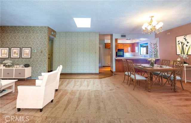 Dining area, breakfast bar and kitchen beyond