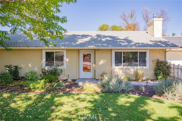 Brick paver walkway brings you to the front door.