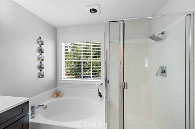 Primary bathroom with separate soaking tub and shower. Mr. and Mrs. Clean live here so it's spotless.