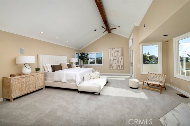 Primary Bedroom with ocean and treed views
