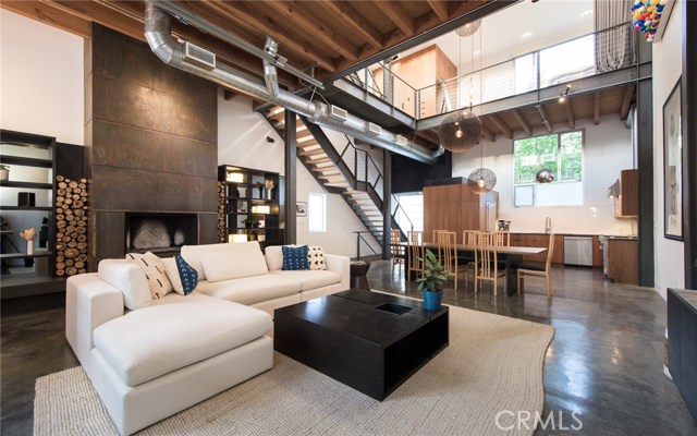 25 Brooks Avenue 4 Venice, California This stunning modern loft by award-winning local architect Steven Ehrlich, AIA offers panoramic ocean views and sophisticated interiors by designer Jae Omar, just moments from the beach, Venice Boardwalk, Abbot Kinney and Rose Avenue. Come up from the beach and pass one of the main film sites for well-known TV show “Californication.” Enter the secure gate with 4 architectural units leading to this corner unit’s open, airy interiors with soaring ceilings and 2.5 story art wall. A light-filled living room features polished concrete floors, expansive windows, large fireplace and a pull-up garage door window that brings the outside ocean air in. A custom chef's kitchen is outfitted with Viking stove, oversized Sub-Zero fridge and custom cabinetry. Suspended over the living room, the master suite features a showroom closet and large master balcony. Both bedrooms offer the option for communal living with no walls or complete privacy by closing the dividers. A private entertainer's rooftop deck with corner ocean views of Catalina and Point Dume fosters a seamless transition between the levels of the loft and the grand finale with sunset facing soaking tub. This unit also comes equipped with full surround sound throughout the house; recently remodeled bathrooms; security system; side-by-side direct access garage which can be used as gym; guest parking for multiple cars; in-unit laundry. 25 Brooks exemplifies modern coastline living in one of L.A.'s most dynamic enclaves.