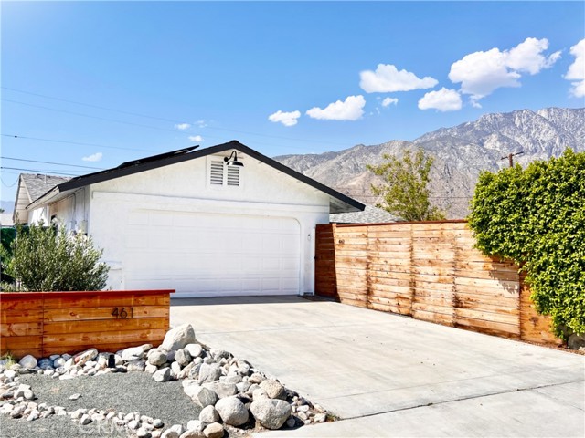 This light-filled single-story home is located just a couple of minutes from Downtown Palm Springs. Opening the front gate you will find a large fully fenced in yard, a walkway to the main entrance of the home, greets you with a soft sage green door and warm faux wood-tiled floors. The hallway leads to an open kitchen, dining room, and a inviting living room leading to a shaded pergola, spa, and lounge area in the backyard. The 4 bedroom 2 bathroom residence features detailed design aesthetics, quartz countertops, stainless steel appliances, white subway tiles in the bathroom, and walk-in rainfall shower system. There is a newly installed triple filtered water system and water heater. Enjoy local events and concerts! Just 15 minutes away at the Palm Springs Arena, 3 minutes from Downtown Palm Springs, and just 15 minutes to Coachella Music Festival. This property is the perfect opportunity for a home to call your own in Palm Springs, as well as the perfect opportunity for someone that is looking for an investment property (AirBnb/STR approved).