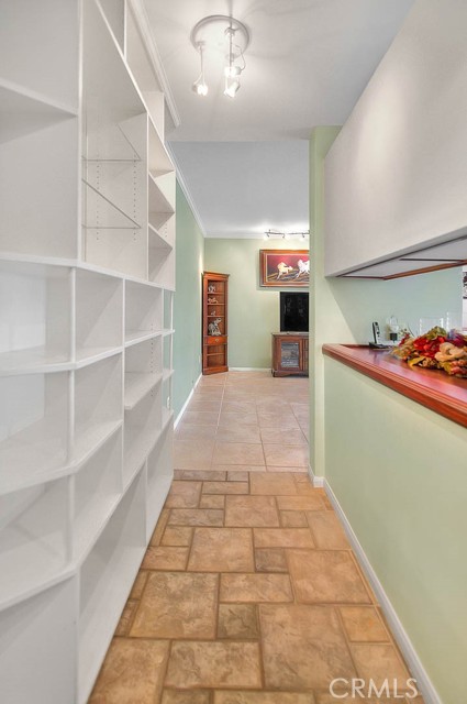 Display Case Hallway To Living Room.  Serving Counter To Right Part Of Built-In China Cabinet