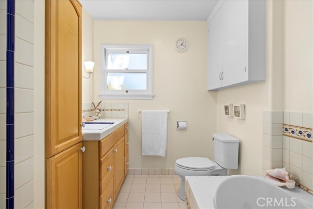 Hall bathroom with separate shower, jetted tub and ample storage