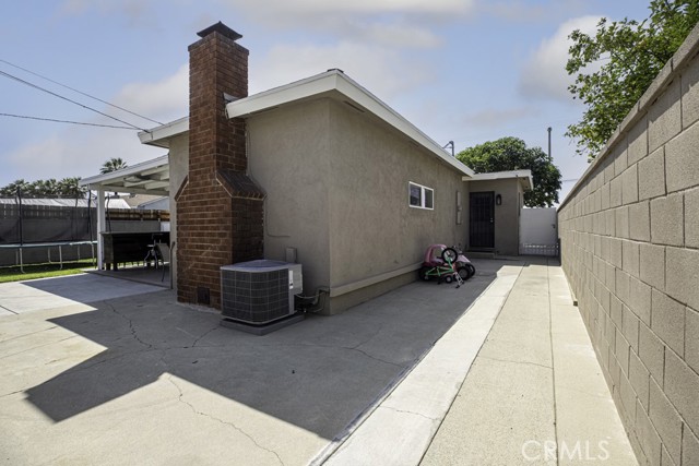 Side of house - access to kitchen/front of home