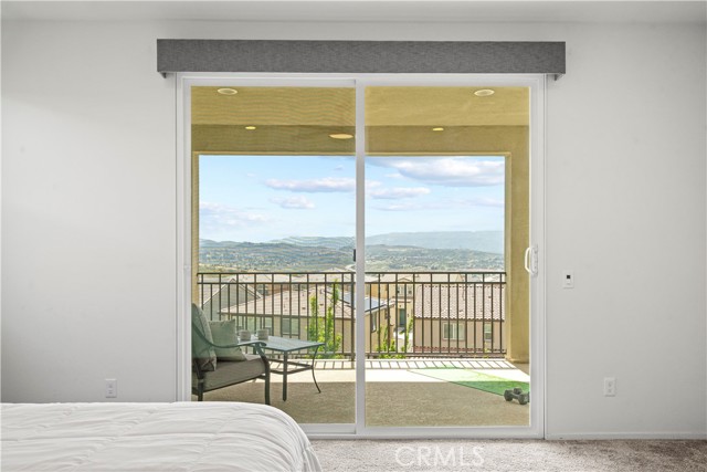 Master bedroom with sliding door to the balcony