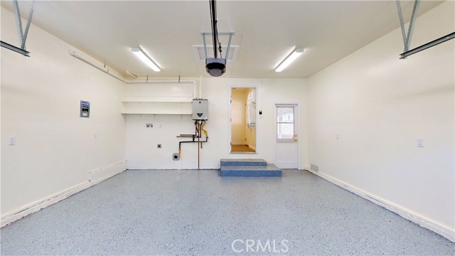 Finished garage with tankless water heater and washer/dryer hookups