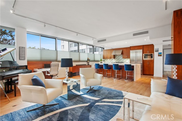 17352 W Sunset Boulevard 102 Pacific Palisades, California Located in a resort-like setting, this newly remodled one bedroom sanctuary is waiting for you! The unit features an open floorplan with large island and gourmet kitchen with 6 burner Capital Professional range oven, Liebherr wine refrigerator and side-by-side refridgerator, water filtarion system, GE convection oven, custom cabinets and quartz countertops. The living space is large and full of light with a view of the Pacific from nearly every room. Features include a built-in Modloft desk, custom built coat closet, storage units, and marble fireplace with included 65" Samsung "The Frame" Art/TV. The floors are engineered hardwood throughout, with tiles flooring in the bathroom. Every inch of space has been maximized to create the most functional yet open livingspace possible. The bedroom is very large and can accomodate oversized furniture, and features a custom designed closet (not pictured) for maximized space and stackable washer/dryer. This ground level unit is just a few steps from the main entry door and the outside property provides many flowering bushes, mature trees, hiking trails, tennis courts, swimming pools, on premisis gym, and spctacular180 degree views of the ocean from Malibu through through the south bay coastline to Palos Verdes. Enjoy your morning coffee overlooking the ocean watching surfers in the morning, and a glass of wine in the evening watching the most beautiful sunsets. Two parking spaces included, with 24/7 security guards in a gated community.