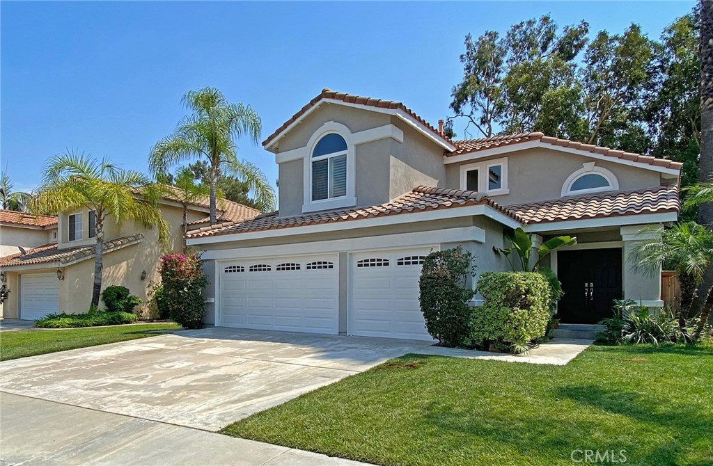 STEP RIGHT INTO A NEWLY UPDATED AND UPGRADED HOME TO CALL YOUR OWN! This Beautiful home is MOVE-IN READY! The double door entry opens to high ceilings with large two story windows that allow for a very light and bright Formal Living/Dining Room that leads to an Updated Kitchen with white cabinets, new hardware and upgraded with new appliances and Quartz counter.  Kitchen overlooks a family room with fireplace and views of a private backyard with patio. The downstairs also offers a 4th bedroom that is currently used as a office or  den but without a closet, a full bathroom with a shower/tub and a large laundry room that gives direct access to a 3 car garage.  The grand staircase leads to a Master Suite with vaulted ceilings & Shutters. A Master Bathroom with separate Tub/Shower, private water closet, dual sinks and large walk-in closet with triple mirrored doors.  Hall Bathroom offers dual sinks, a private tub/shower area and serves 2 Secondary Bedrooms. UPGRADES include New Carpet, New Interior Designer color and Exterior Paint, All Interior Doors and Front Doors with New Hardware, New Light Fixtures and Tile Flooring in Bathrooms upstairs, Windows have all been replaced, New Fixtures in Entry and Dining Room and Exterior Lighting is new. Newer Stainless Steel Appliances, Beautiful White Quartz Kitchen Counters and more!  Walk to Award Winning Schools, Community Park, Pool/Spa, Sport Courts, Tennis and Tot Lot.  Close to shopping, dining, toll roads and freeways.