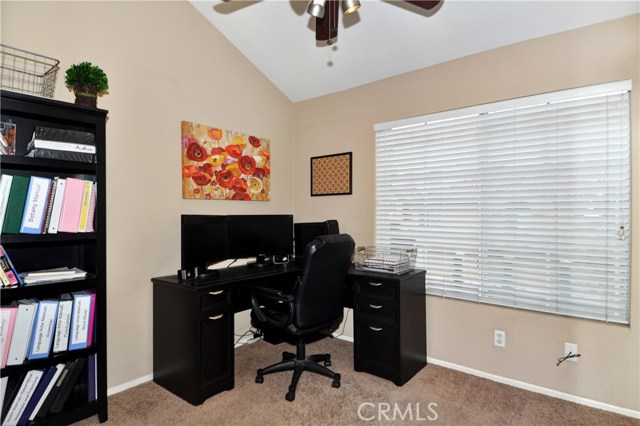 Second bedroom has vaulted ceilings. Being used as an office.