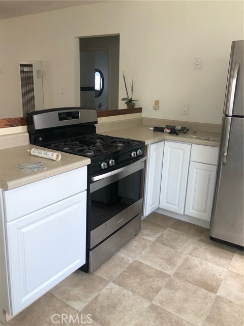 Front unit Kitchen showing new appliances, new flooring and kitchen cabinetry